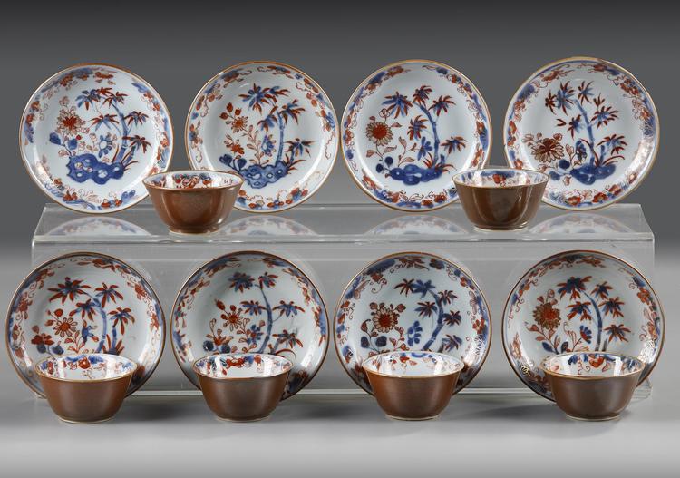 A GROUP OF FOURTEEN OF CHINESE IMARI CAFE AU LAIT-GROUND CUPS AND SAUCERS