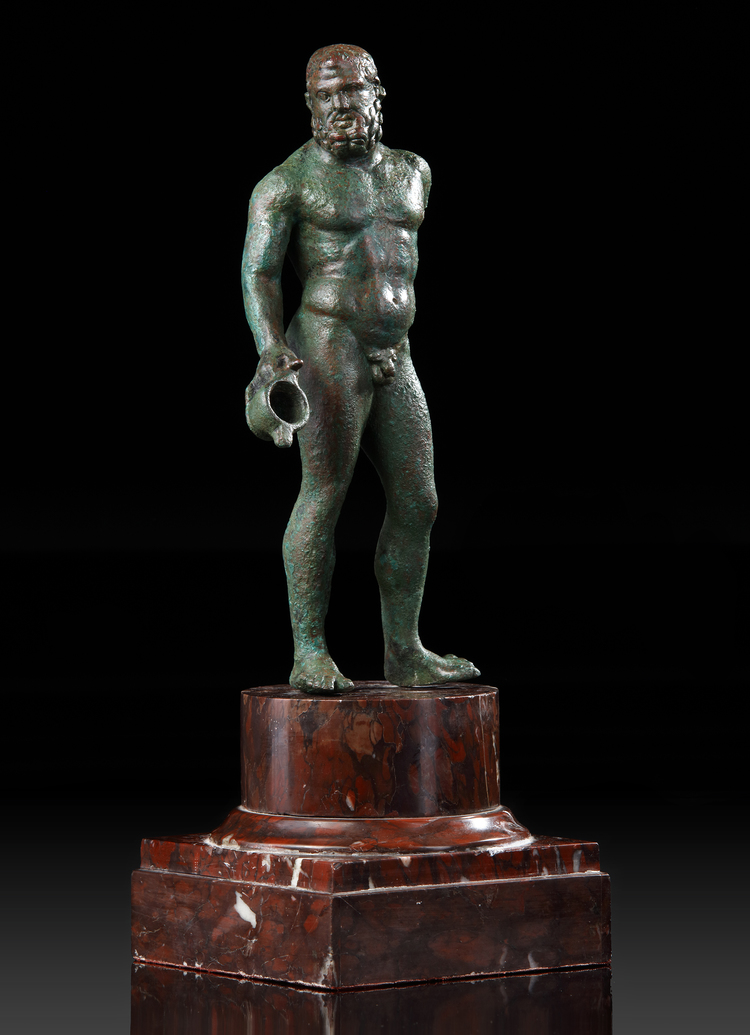 A GRECO ROMAN BRONZE STATUETTE OF HERAKLES, CIRCA 1ST CENTURY B.C. / A.D.