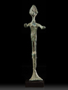 A CANAANITE BRONZE STANDING FIGURE, CIRCA 2ND MILLENIUM B.C.