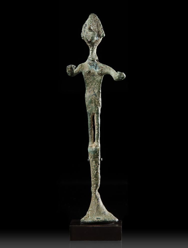 A CANAANITE BRONZE STANDING FIGURE, CIRCA 2ND MILLENIUM B.C.