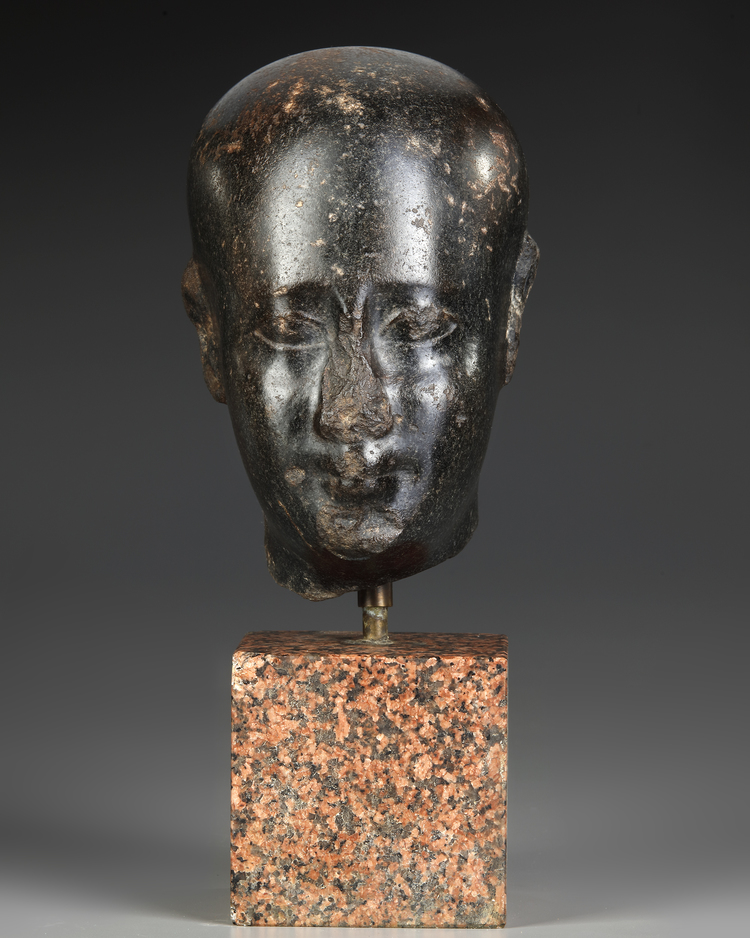 AN EGYPTIAN DIORITE HEAD OF AN OFFICIAL, LATE PERIOD, 30TH DYNASTY, 380-343 B.C.