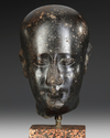 AN EGYPTIAN DIORITE HEAD OF AN OFFICIAL, LATE PERIOD, 30TH DYNASTY, 380-343 B.C.