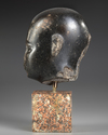 AN EGYPTIAN DIORITE HEAD OF AN OFFICIAL, LATE PERIOD, 30TH DYNASTY, 380-343 B.C.