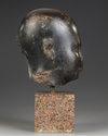 AN EGYPTIAN DIORITE HEAD OF AN OFFICIAL, LATE PERIOD, 30TH DYNASTY, 380-343 B.C.