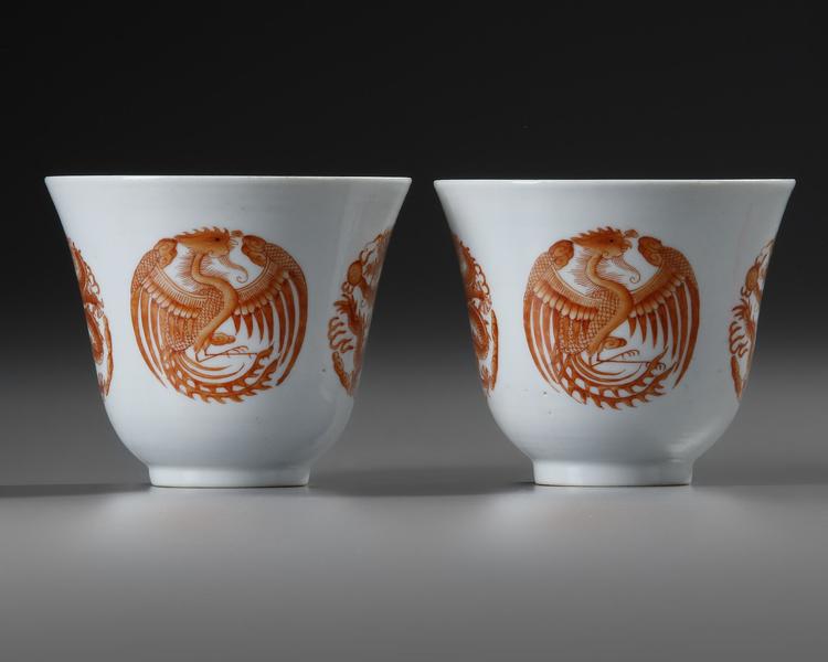 A PAIR OF CHINESE IRON-RED 'DRAGON AND PHOENIX' CUPS