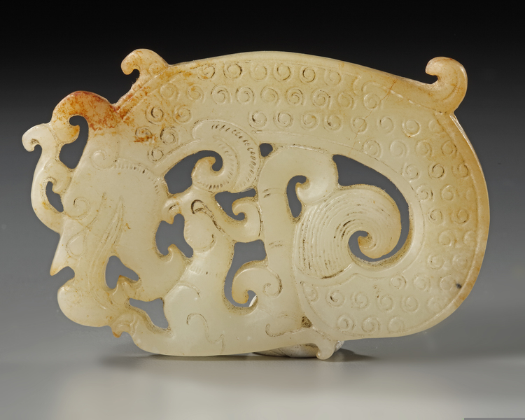 A  CHINESE PALE CELADON AND RUSSET JADE 'DRAGON AND PHOENIX' PLAQUE, 19TH CENTURY