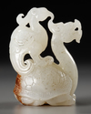 A GROUP OF CHINESE WHITE AND PALE CELADON JADE MYTHICAL BEAST CARVINGS, 20TH CENTURY