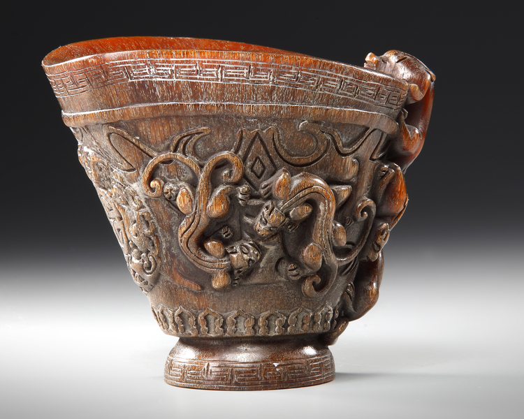 A CHINESE CARVED BUFFALO HORN LIBATION CUP, 19TH CENTURY