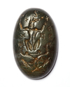 A ROMAN GREEN MOTTLED JASPER MAGICAL GNOSTIC INTAGLIO WITH ANUBIS SEATED, CIRCA 3RD-4TH CENTURY A.D.