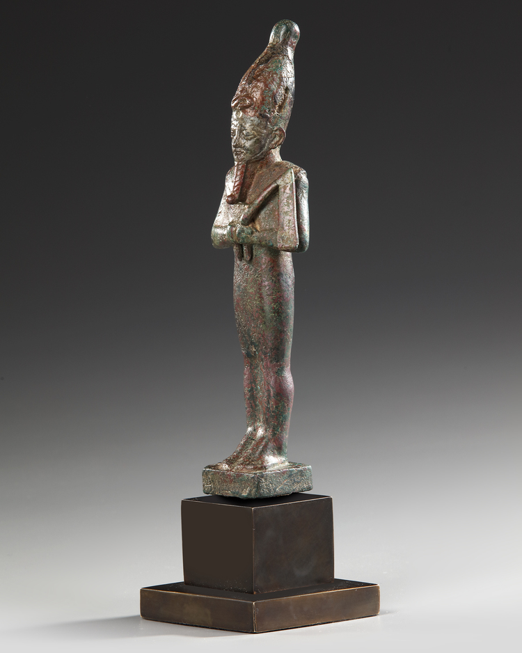 AN EGYPTIAN BRONZE OSIRIS STATUE, 26TH DYNASTY, CIRCA 664–525 B.C.