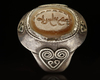 AN AGATE SEAL SILVER RING, 7TH CENTURY