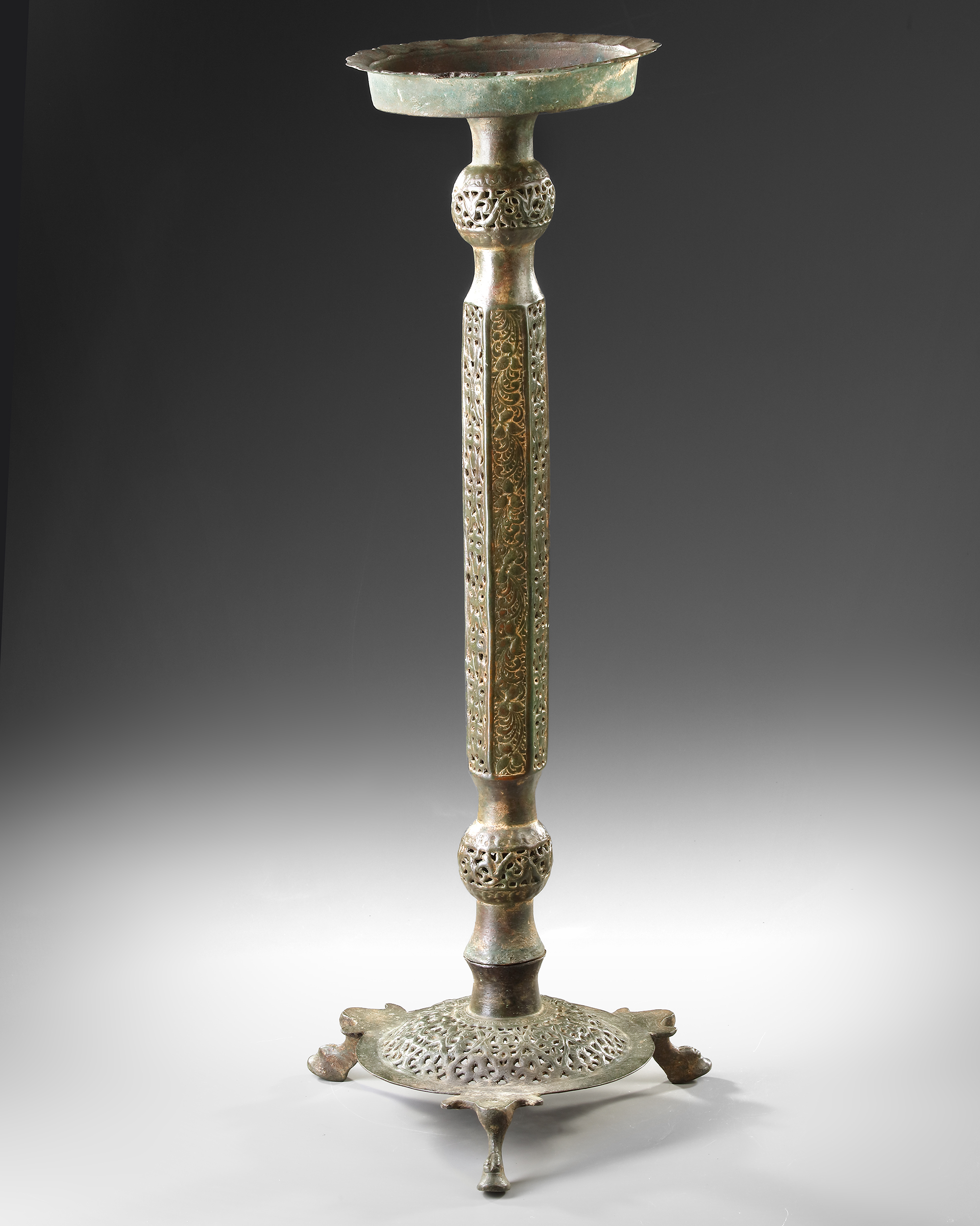 AN ISLAMIC OPENWORK OIL LAMP AND STAND, KHORASAN, PERSIA, 12TH CENTURY