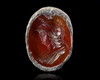 A CARNELIAN INTAGLIO OF MINERVA IN A SILVER MOUNT, 2ND CENTURY AD
