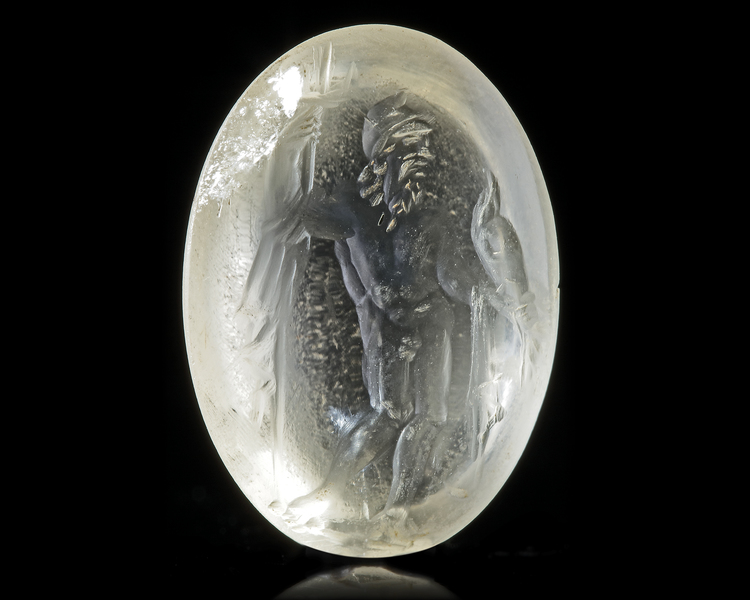 A ROCK CRYSTAL INTAGLIO OF NEPTUNE, 1ST CENTURY AD