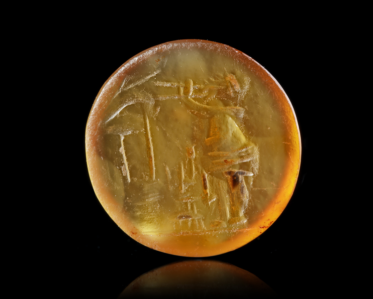 A ROMAN CARNELIAN INTAGLIO OF A SATYR, 1ST CENTURY AD