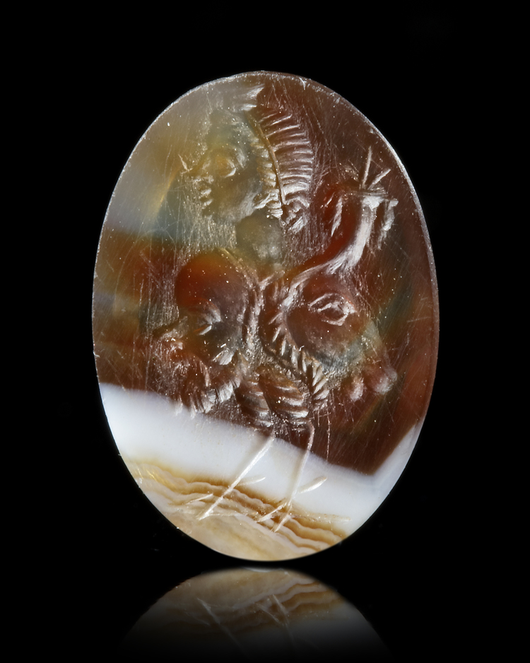 A BANDED AGATE INTAGLIO OF A GRYLLOS, 1ST CENTURY BC-AD