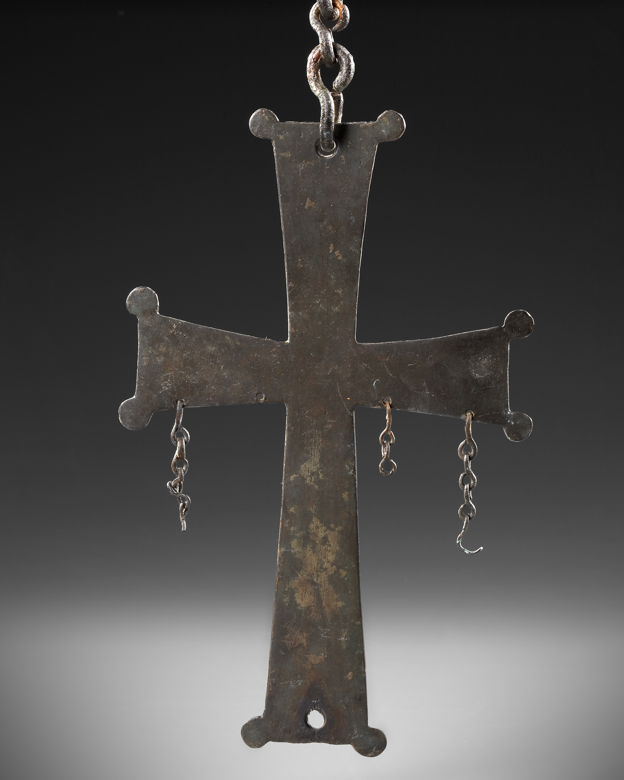 A BYZANTINE BRONZE CROSS WITH GREEK DEDICATION, CIRCA 8TH10TH CENTURY A.D.