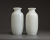 A pair of Chinese milky-white glass vases