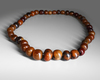 A STRING OF BEADS, 20TH CENTURY