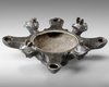 A ROMAN BRONZE OIL LAMP WITH FOUR SPOUTS AND BUSTS OF MERCURY, CIRCA 1ST-2ND CENTURY A.D