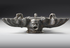 A ROMAN BRONZE THREE-NOZZLED OIL LAMP WITH THEATRE MASK AND ROSETTES AS DECORATION, CIRCA 1ST-2ND CENTURY A.D.