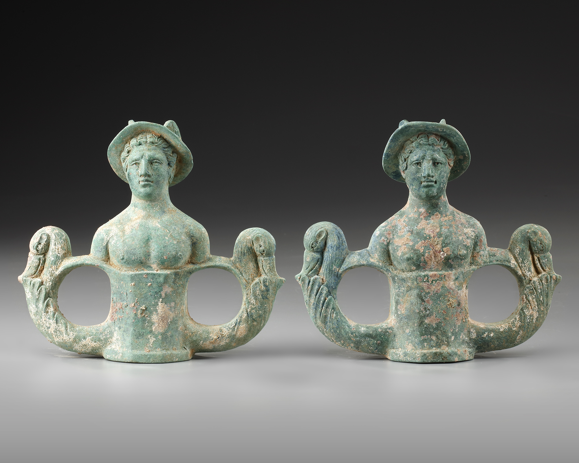 A Pair Of Bronze Chariot Fittings With The Busts Of Mercury Roman 1st 2nd Century Ad