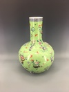 A Chinese green-ground famille rose appliqué decorated bottle vase