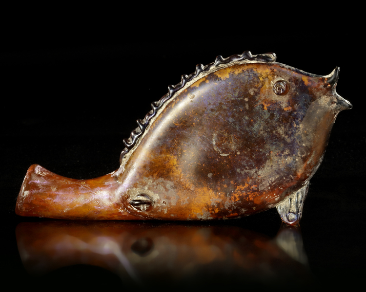 A ROMAN GLASS FLASK IN THE FORM OF A FISH, CIRCA 3RD CENTURY A.D.