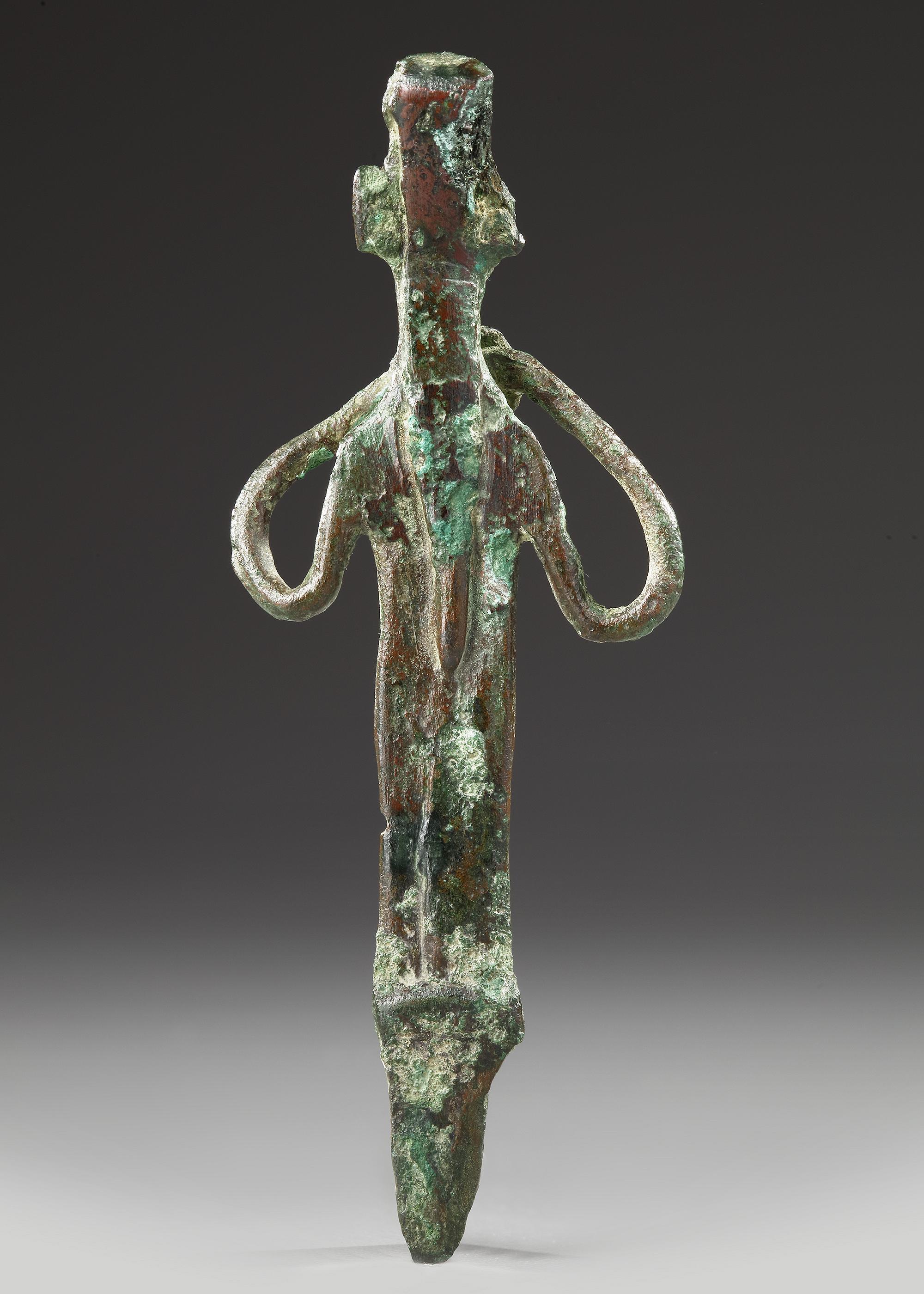 AN ELAMITE BRONZE IDOL, CIRCA 2ND MILLENNIUM B.C.