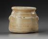 AN EGYPTIAN TRAVERTINE TWO-HANDLED JAR, CIRCA 1069-404 B.C.