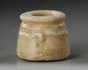 AN EGYPTIAN TRAVERTINE TWO-HANDLED JAR, CIRCA 1069-404 B.C.