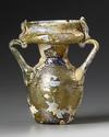 AN INTACT ROMAN OLIVE YELLOW GLASS TWIN-HANDLED JAR, CIRCA 4TH CENTURY A.D.