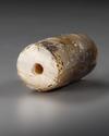 A NEO-BABYLONIAN CYLINDER BANDED AGATE CYLINDER SEAL, CIRCA 900-700 B.C.