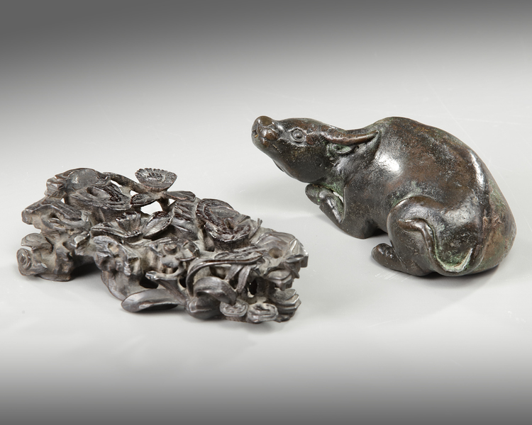 A CHINESE BRONZE BUFFALO ON A STAND, MING DYNASTY (1368-1644)