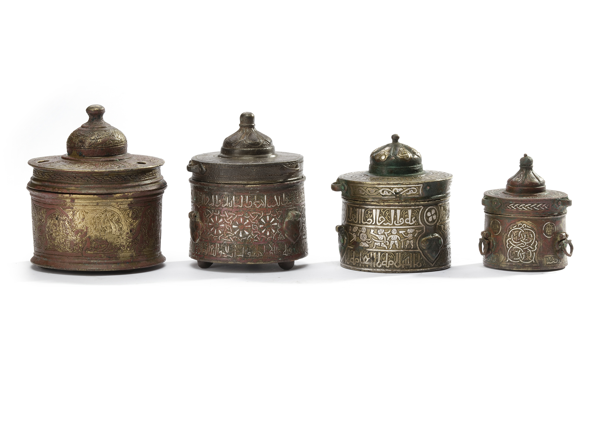 FOUR KHURASAN SILVER- INLAID BRONZE INKWELLS, 12TH-13TH CENTURY