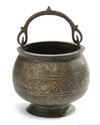 A KHURASAN COPPER-INLAID CAST BRONZE BUCKET WITH THE ZODIAC SIGNS, PERSIA, 13TH CENTURY