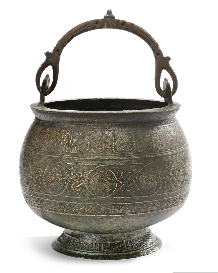 A KHURASAN COPPER-INLAID CAST BRONZE BUCKET WITH THE ZODIAC SIGNS, PERSIA, 13TH CENTURY