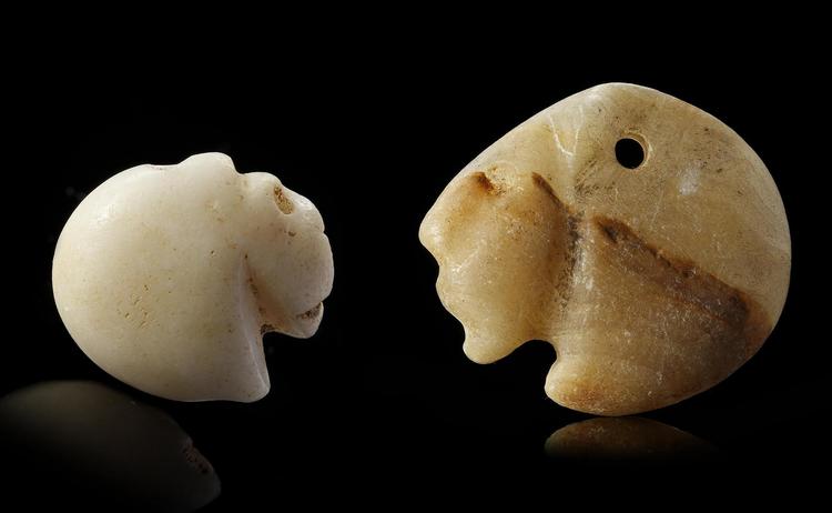 TWO WESTERN ASIATIC SEAL AMULETS IN THE FORM OF LION HEADS, CIRCA 3300-2900 B.C.
