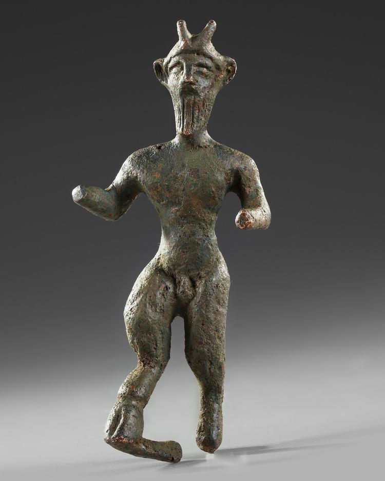 A LATE ROMAN BRONZE FIGURE OF PAN, CIRCA 4TH-5TH CENTURY A.D.