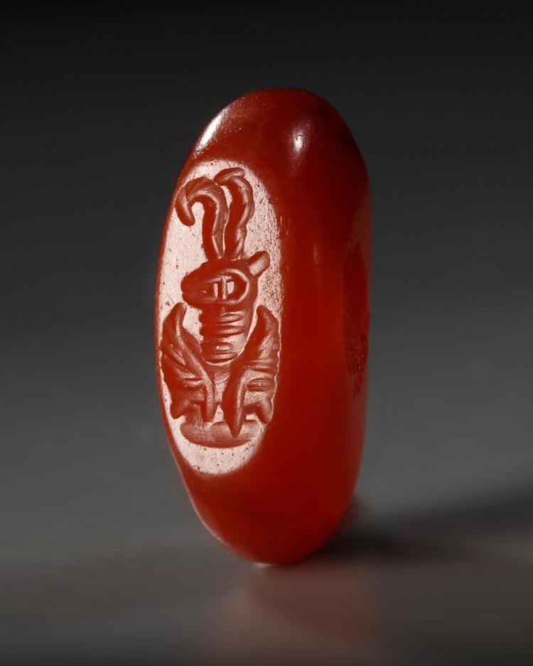 A SASSANIAN RED AGATE STAMP SEAL, CIRCA 300-600 A.D.