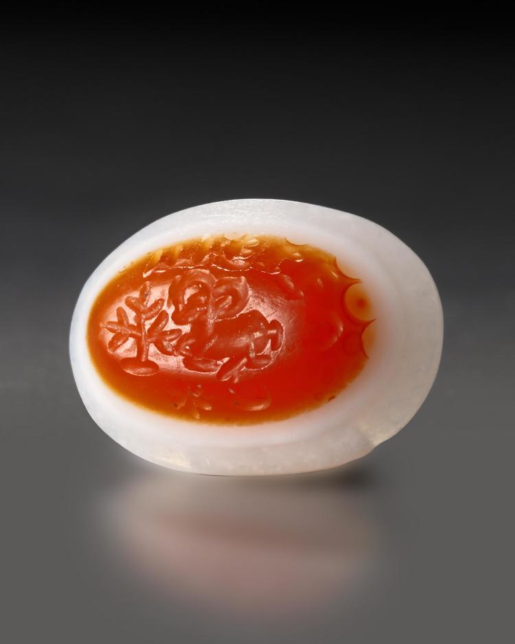 A SASSANIAN AGATE STAMP SEAL WITH STAG AND PAHLAVI INSCRIPTION, CIRCA 4TH-5TH CENTURY A.D.