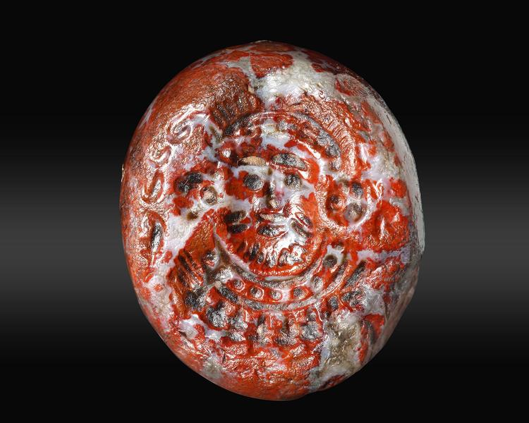 A SASSANIAN BLOOD STONE DOMED SEAL WITH PORTRAIT BUST, CIRCA 5TH CENTURY A.D.