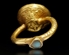 A GOLD INSCRIBED SEAL RING