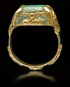 A TURQUOISE SEAL GOLD RING