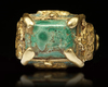 A TURQUOISE SEAL GOLD RING