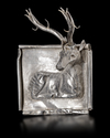 AN ACHAEMENID SILVER PLAQUE WITH SEATED STAG, CIRCA 550-500 B.C.