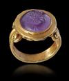 A ROMAN GOLD RING WITH AMETHYST INTAGLIO, CIRCA 2ND-3RD CENTURY A.D.