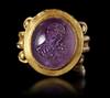 A ROMAN GOLD RING WITH AMETHYST INTAGLIO, CIRCA 2ND-3RD CENTURY A.D.