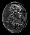 A ROMAN CARNELIAN INTAGLIO WITH THE BUST OF APOLLO, CIRCA 1ST CENTURY B.C. / A.D.