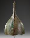 A WESTERN ASIATIC POINTED AND CONICAL BRONZE HELMET, CIRCA 800-600 B.C.